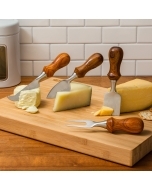 The Rockler Four-Piece Cheese Knife Turning Kit completed and set up next to blocks of cheese