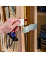 Person opening a cabinet with the Rockler Tandem Door Hinge Set