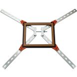 The Frame Clamp Kit holding a picture frame against a white background