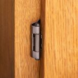 1/4" Overlay, Oil Rubbed Bronze, Single Demountable Hinge in a closed position on cabinet