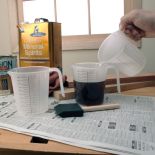 Three Stackable Mixing Cups being used to mix stain