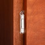 Partial Wrap 1/2" Overlay Hinge installed on a cabinet
