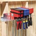 The Rockler 24'' Parallel Clamp Rack installed on wall
