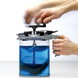 The Rockler Mixing Mate® Paint Lid, Gallon Size mixing blue paint