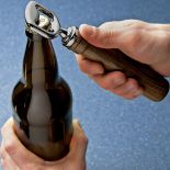 A completed Rockler Pewter Bottle Opener being used to open a bottle