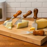 The Rockler Four-Piece Cheese Knife Turning Kit completed and set up next to blocks of cheese