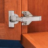 Blum&reg; 120&deg; Overlay Clip Top 3-Way Face Frame Hinges installed on a cabinet