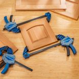 Rockler One-Handed Bar Clamps holding cabinet door