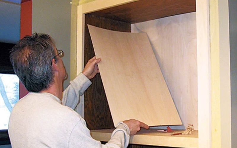 Reinstalling shelf in upper chamber of storage cabinet