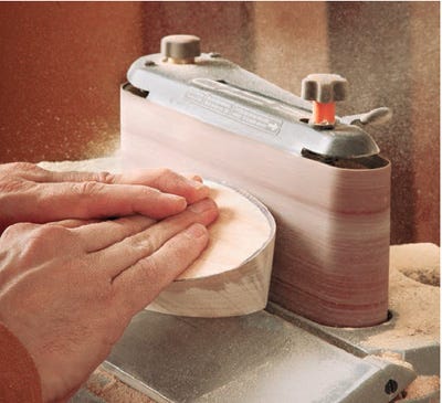 Sanding toy boat with oscillating belt sander