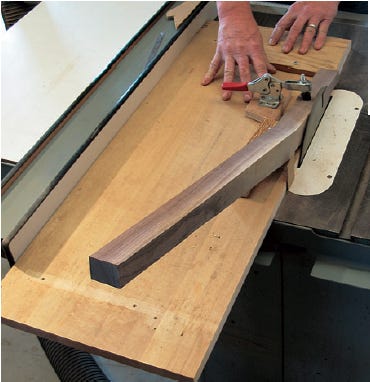 Using shop-made taper cutting jig to shape chair leg