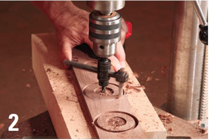 Cutting the hubcaps with drill press bit