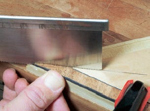 Test cut inlay strips with hand saw