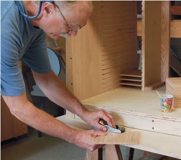 Smoothing cabinet shelving with a hand plane
