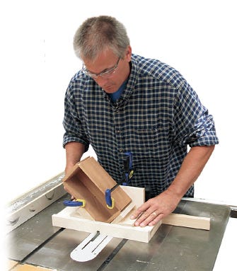 Cutting box corner dadoes using table saw sled to guide the cut