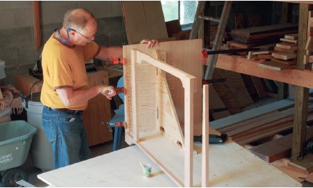 Attaching corner brackets to the rest of the cabinet's interior'