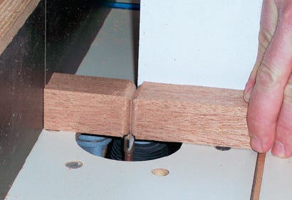 Shaping top of the table foot with router