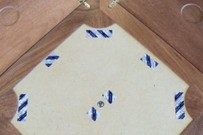 Carpet tape attached to interior of envelope table