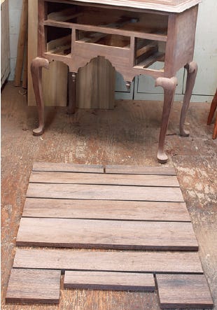 Lay out cut drawer front stock for highboy