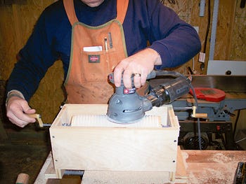Sanding rolling pin sleeve in box jig
