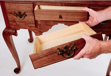 Test fitting dovetailed drawers in the highboy