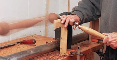 Turning highboy cabinet feet on a lathe