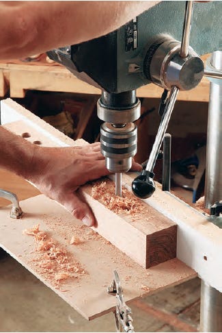 Using a drill press to chop out bench mortises
