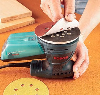 Changing disks on hook-and-loop sander