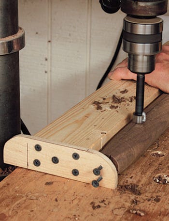 Boring holes for the chair rung with a drill press