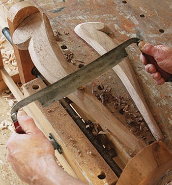 Carving shaker chair arms with a drawknife