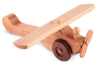 Assembled toy airplane finished with spray-on shellac