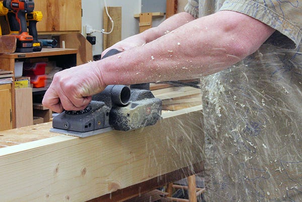 hand planer shooting wood chips