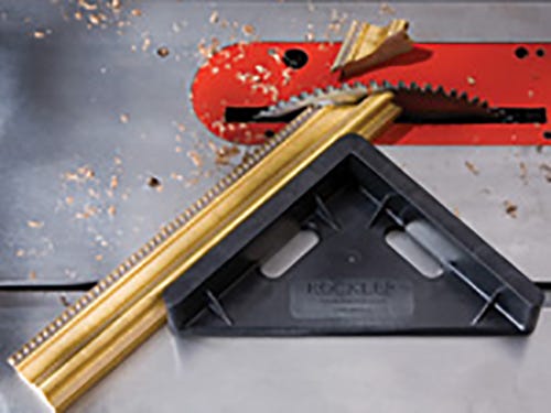Using a miter cutting sled to form a forty five degree angle