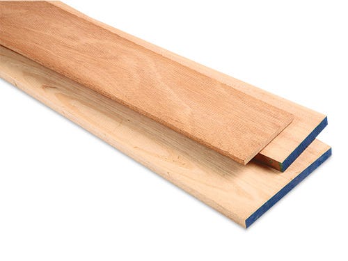 Stack of African mahogany lumber of various sizes