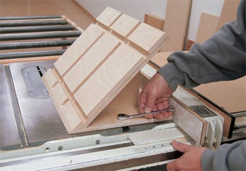 Test fitting mitering jig on table saw fence