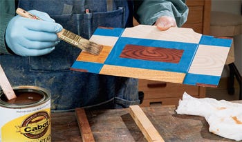 Alternating panel finishes between light and dark stains
