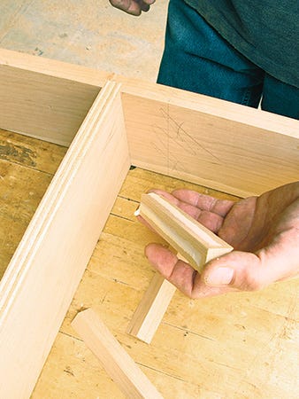 Adding corner glue blocks to media center casework