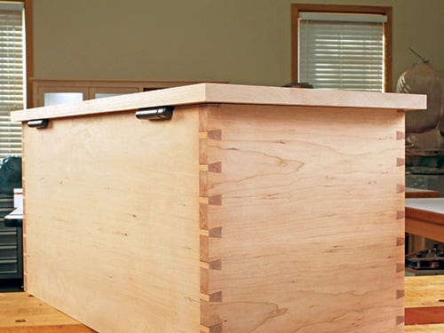 Lid stay torsion hinge installed flush between lid and casework