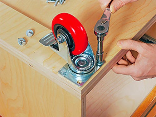 Installing casters on the base of a cabinet