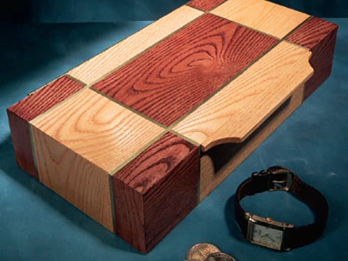 Small box with stain patterns and small brass inlay pattern