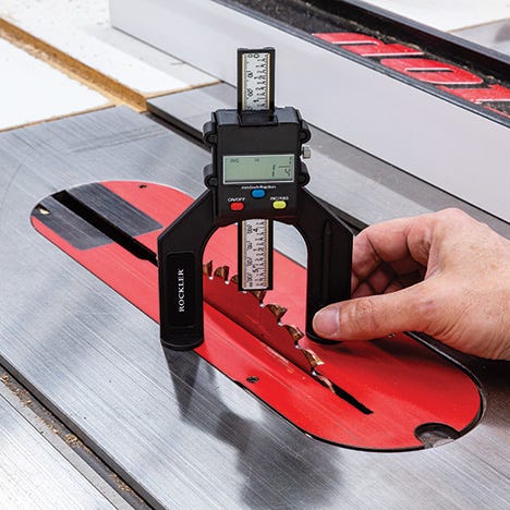 Checking table saw blade height with height gauge