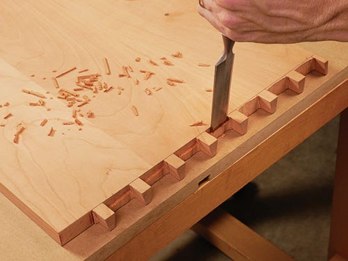 Cutting away waste from the bottom of dovetail sockets with a chisel
