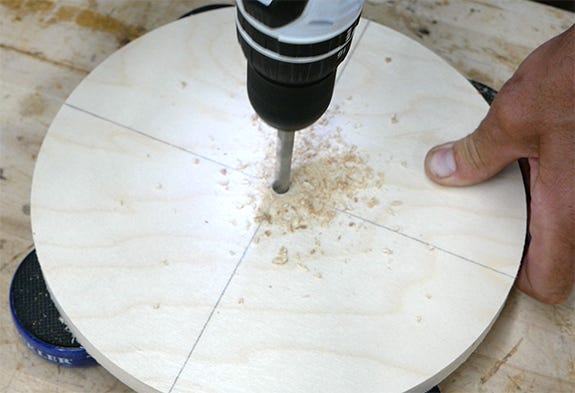 drilling a hole through center of a clock face