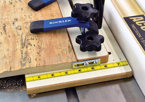 Tapering jig stop, hold downs and measuring tape