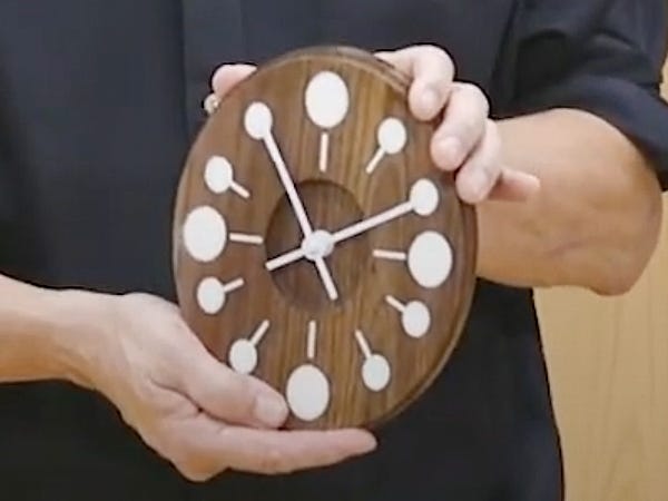 wood modern clock with white circles for numbers