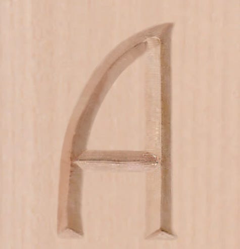Carved sign letter that has been sanded