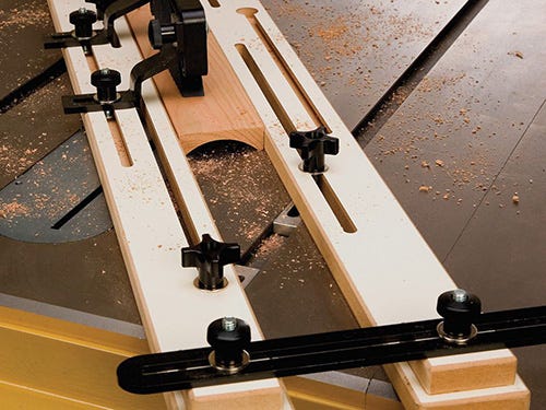Cutting coves on a table saw using a jig
