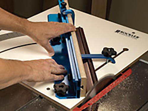 Using a crosscut sled on a table saw to cut molding