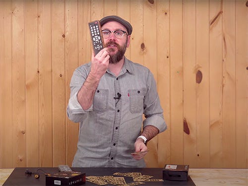 David Picciuto showing a wood veneered television remote