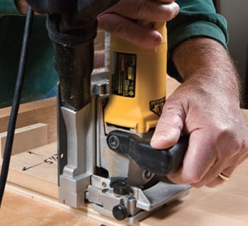 Using marking gauge to guide slot cuts